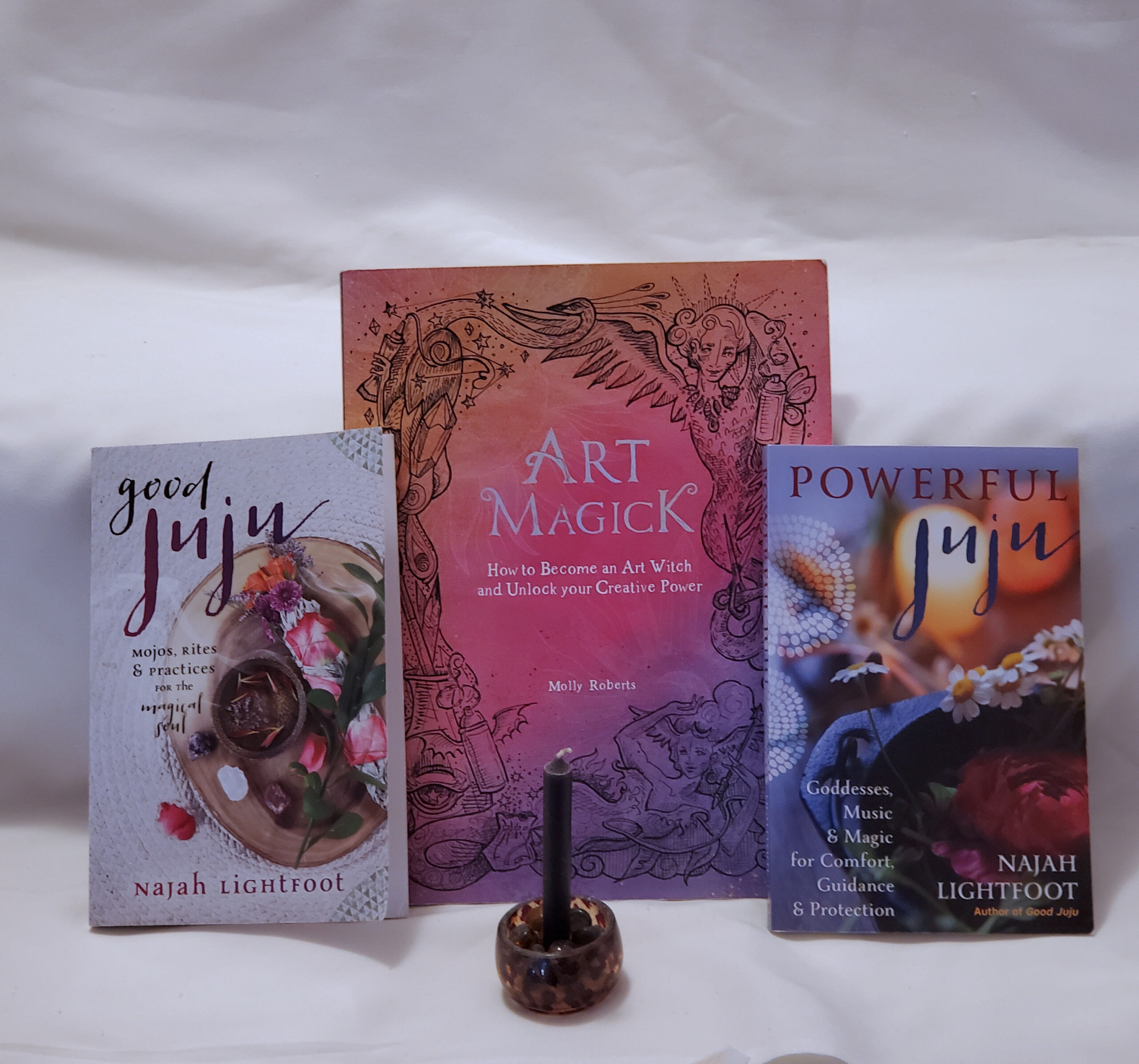 Three books and one black candle